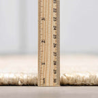 Iantha Tasseled Jute Area Rug