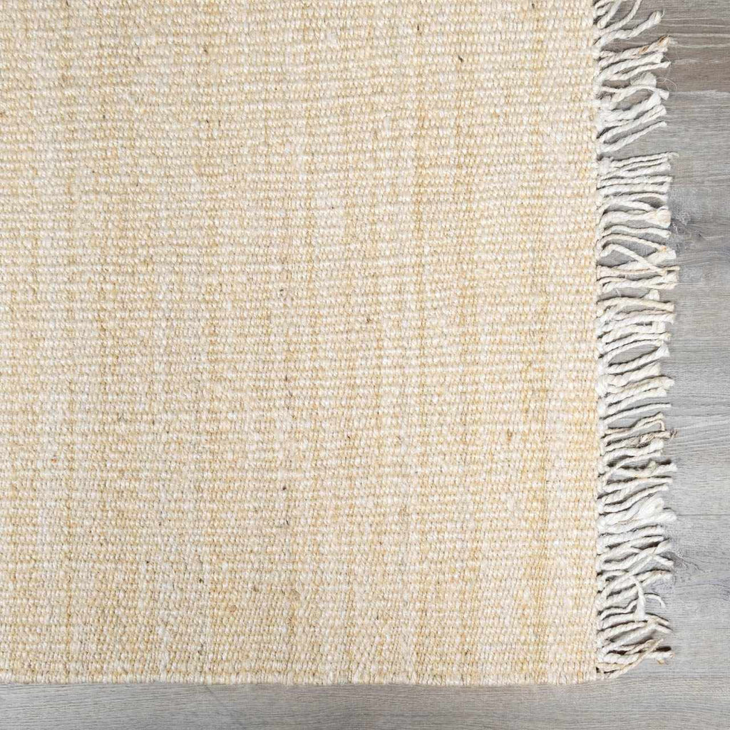 Iantha Tasseled Jute Area Rug